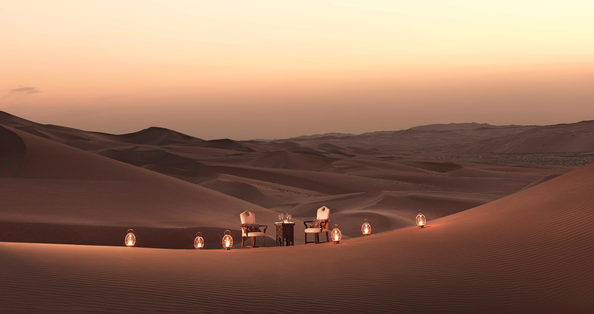 Chairs and table on a desert dune