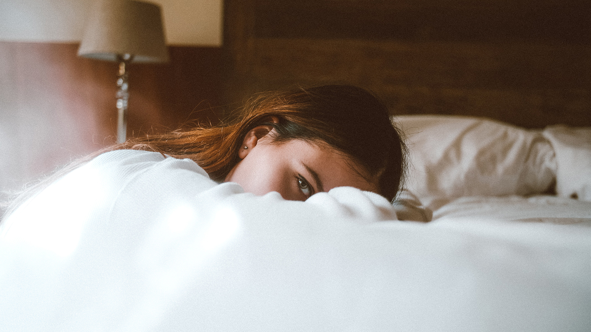 Woman Resting On Bed