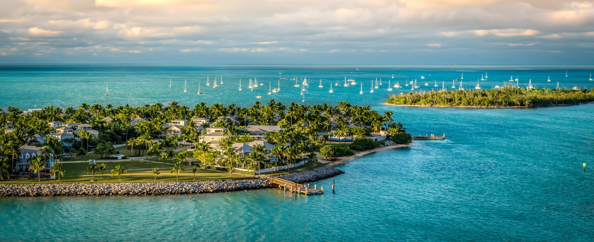Florida key islands with palm trees and white boats in the sea