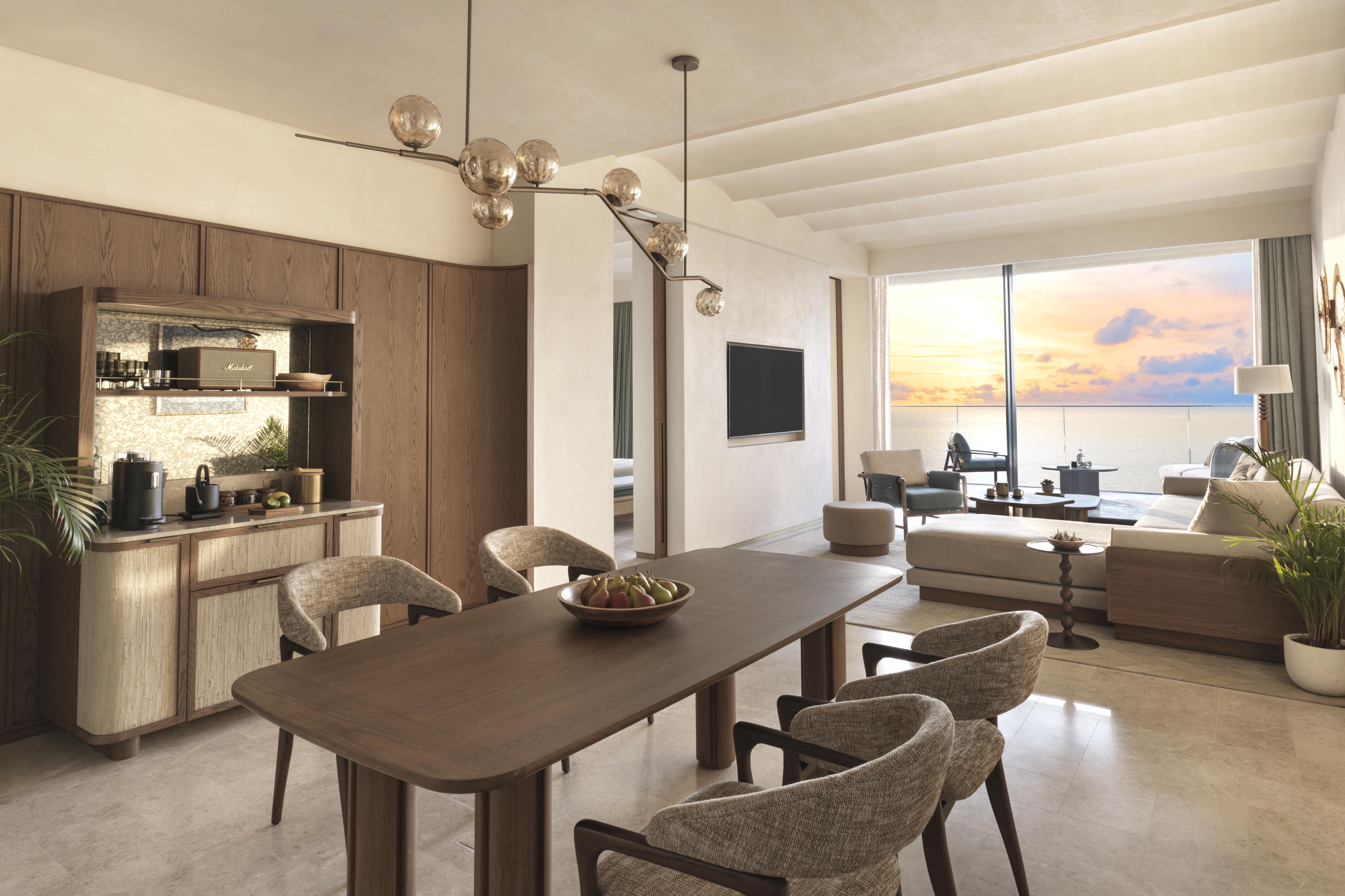 Copilot said:  Six Senses The Palm Dubai Breeze Suite living room featuring elegant dining space, contemporary interiors and a private terrace with panoramic Arabian Gulf views