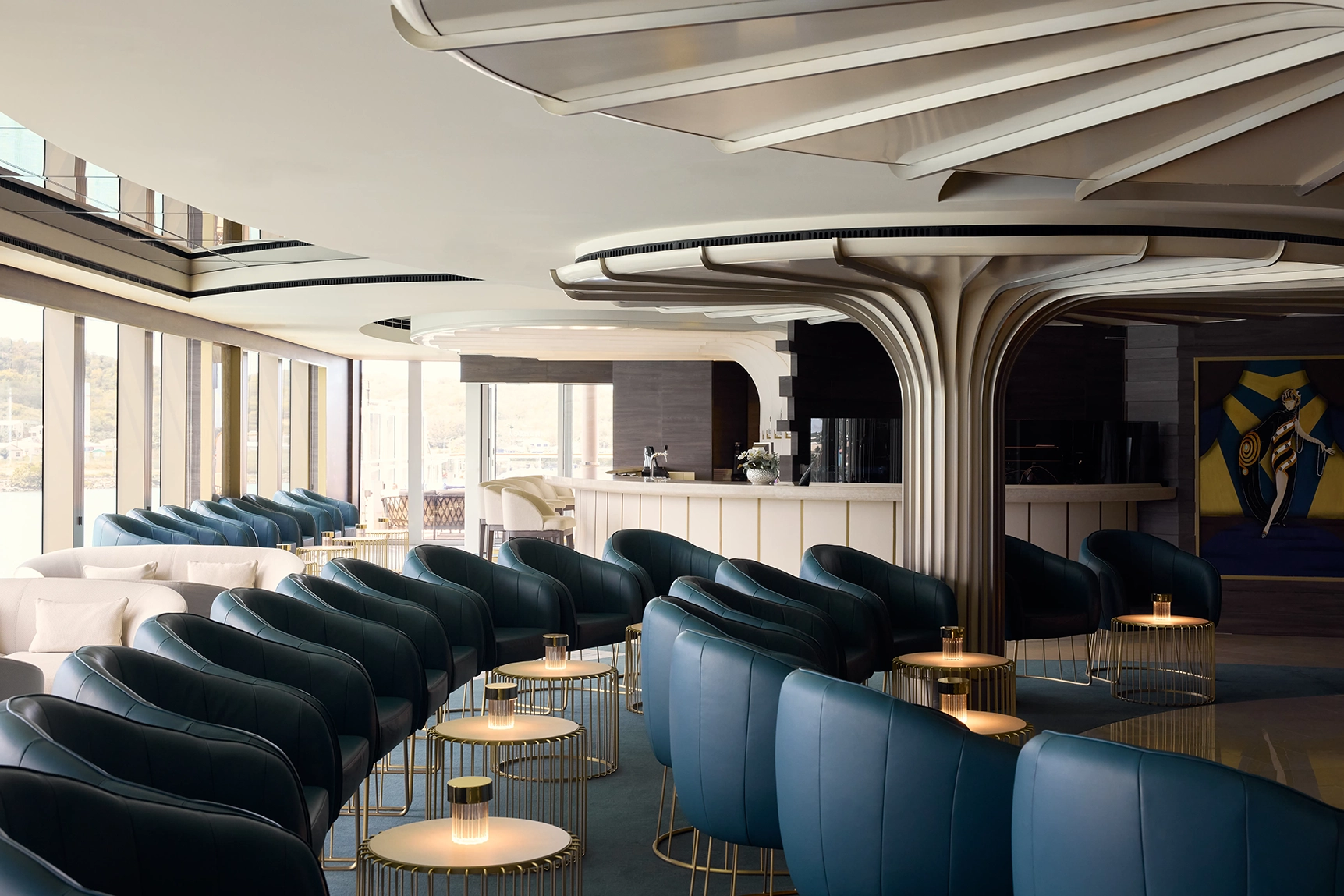 Blue armshira arranged in a semi circle in the astern lounge onboard the Explora I cruise ship