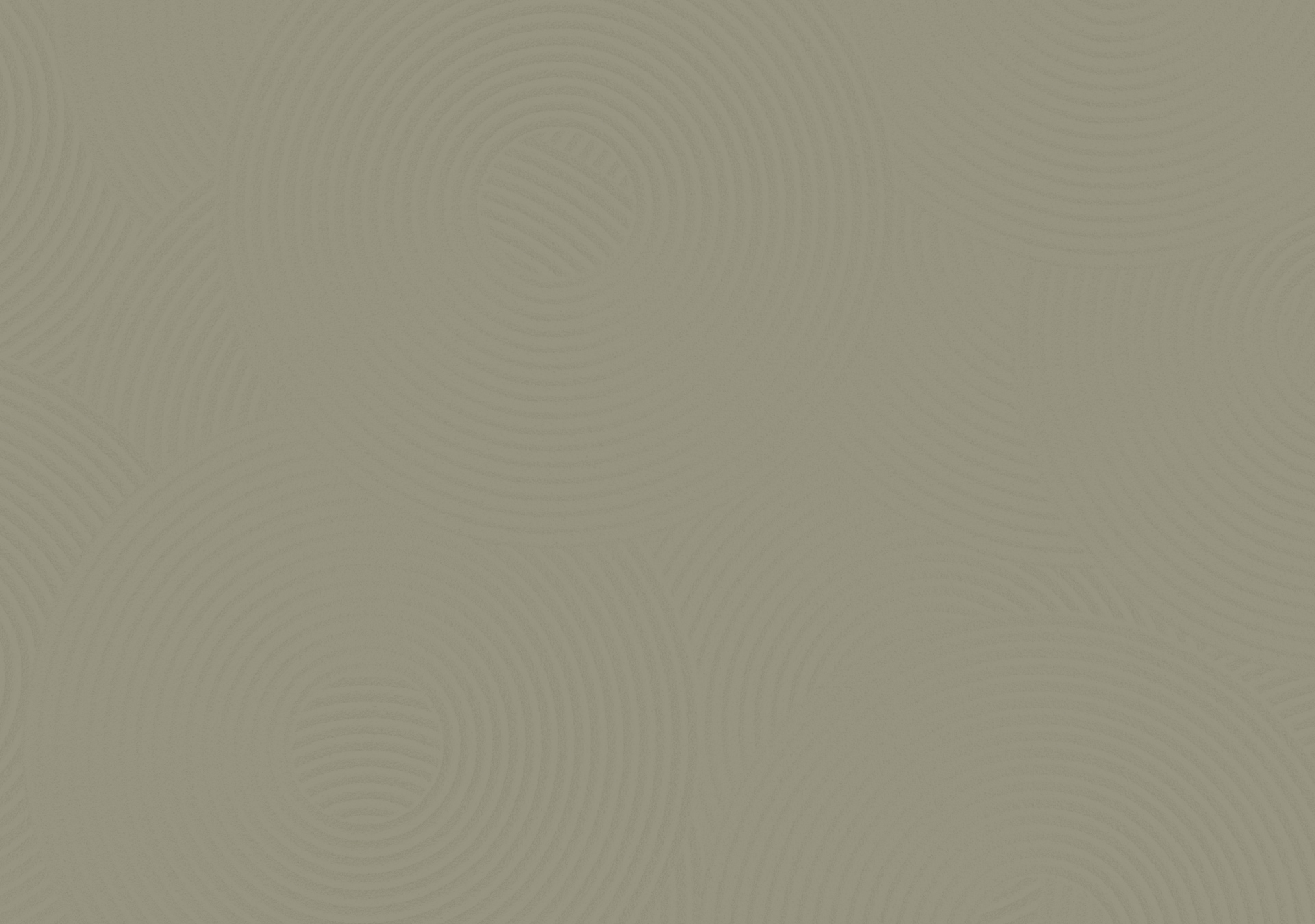 Abstract sand pattern with concentric circular lines creating a calming, textured surface with a green overlay