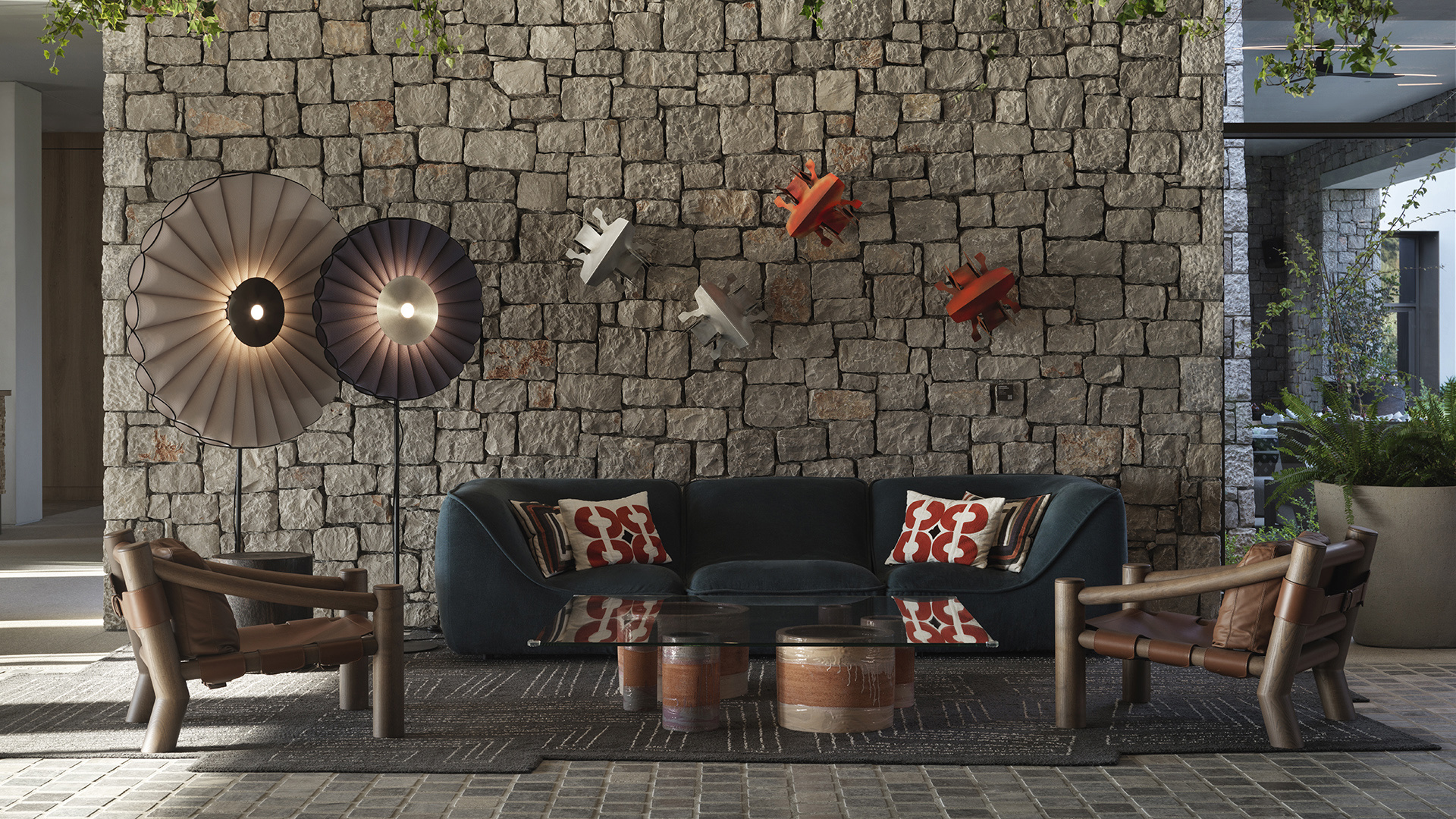 Sofa and chairs against a stone wall with artwork at W Costa Navarino