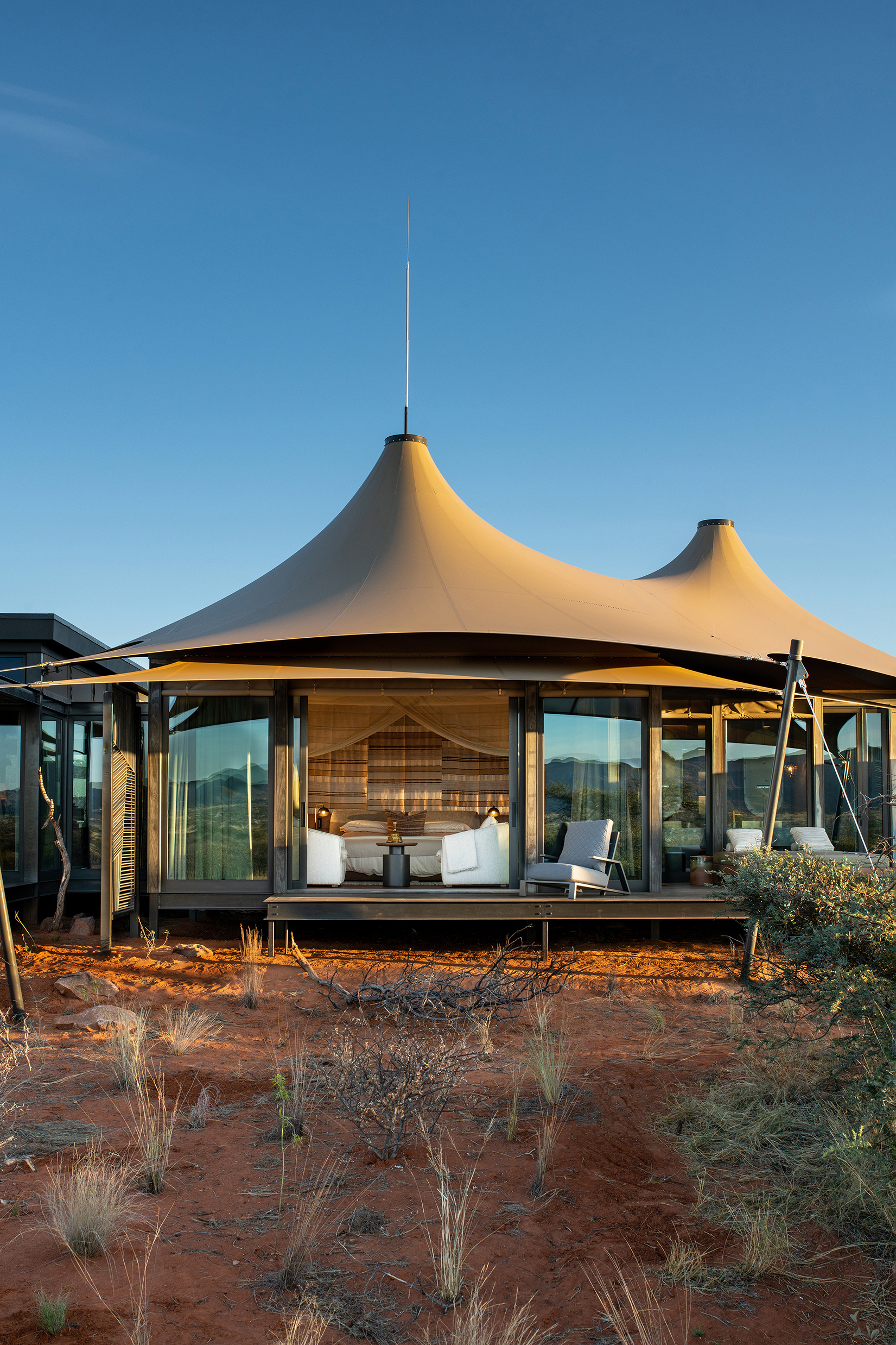 Exterior of Loapi tented camp bedroom tent with conical room surrounded by bushland