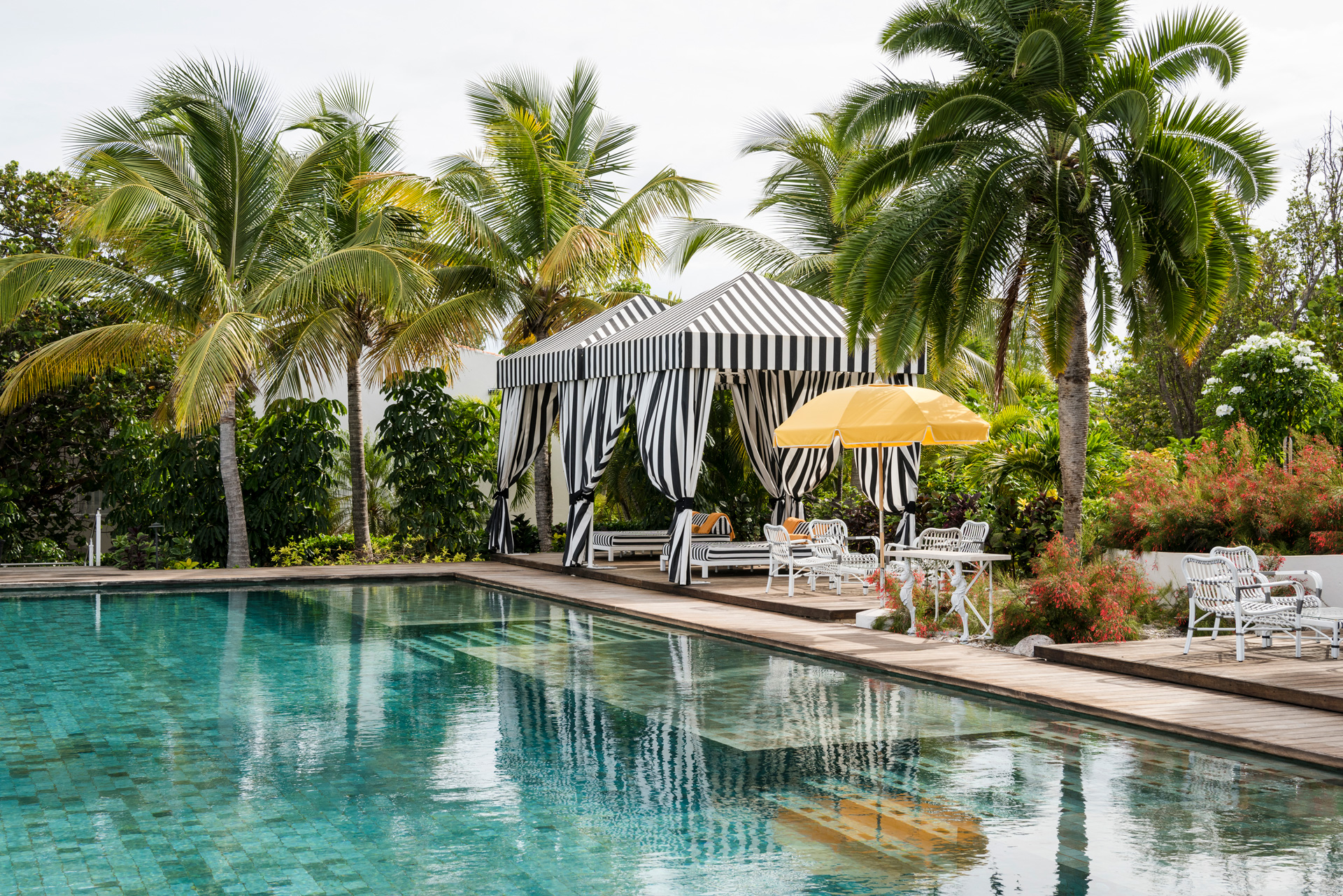 Seating and sun loungers at the side of a pool