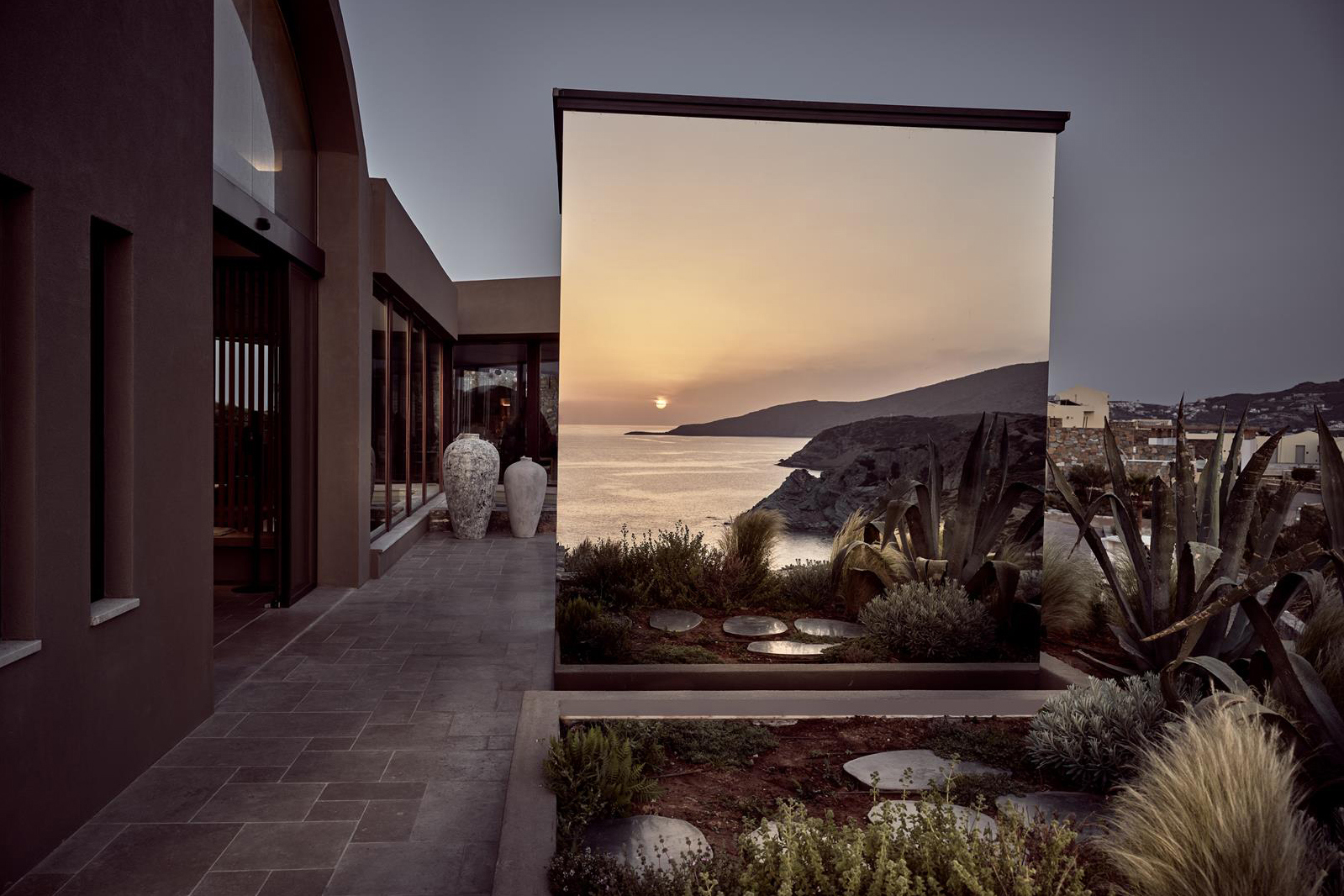Mirrored selfie cube reflecting the landscape at Acro Wellness Suites