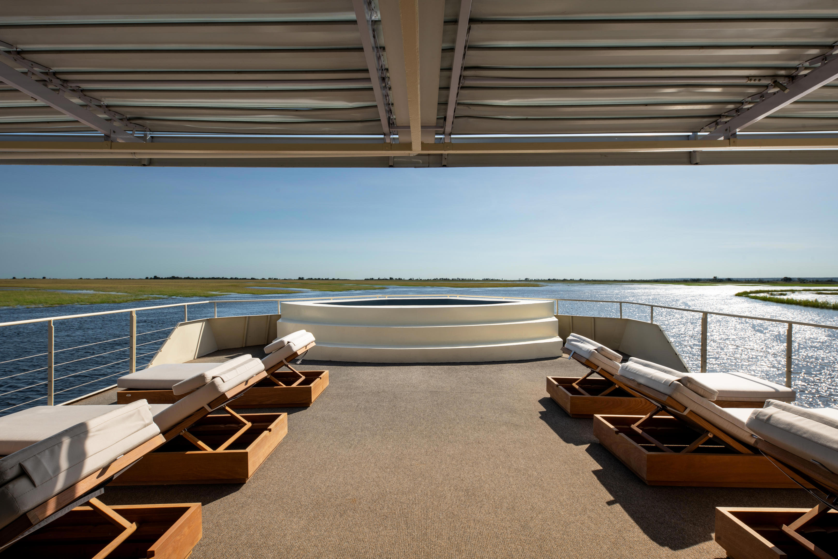 Deck of Zambezi Queen with loungers and hot tub
