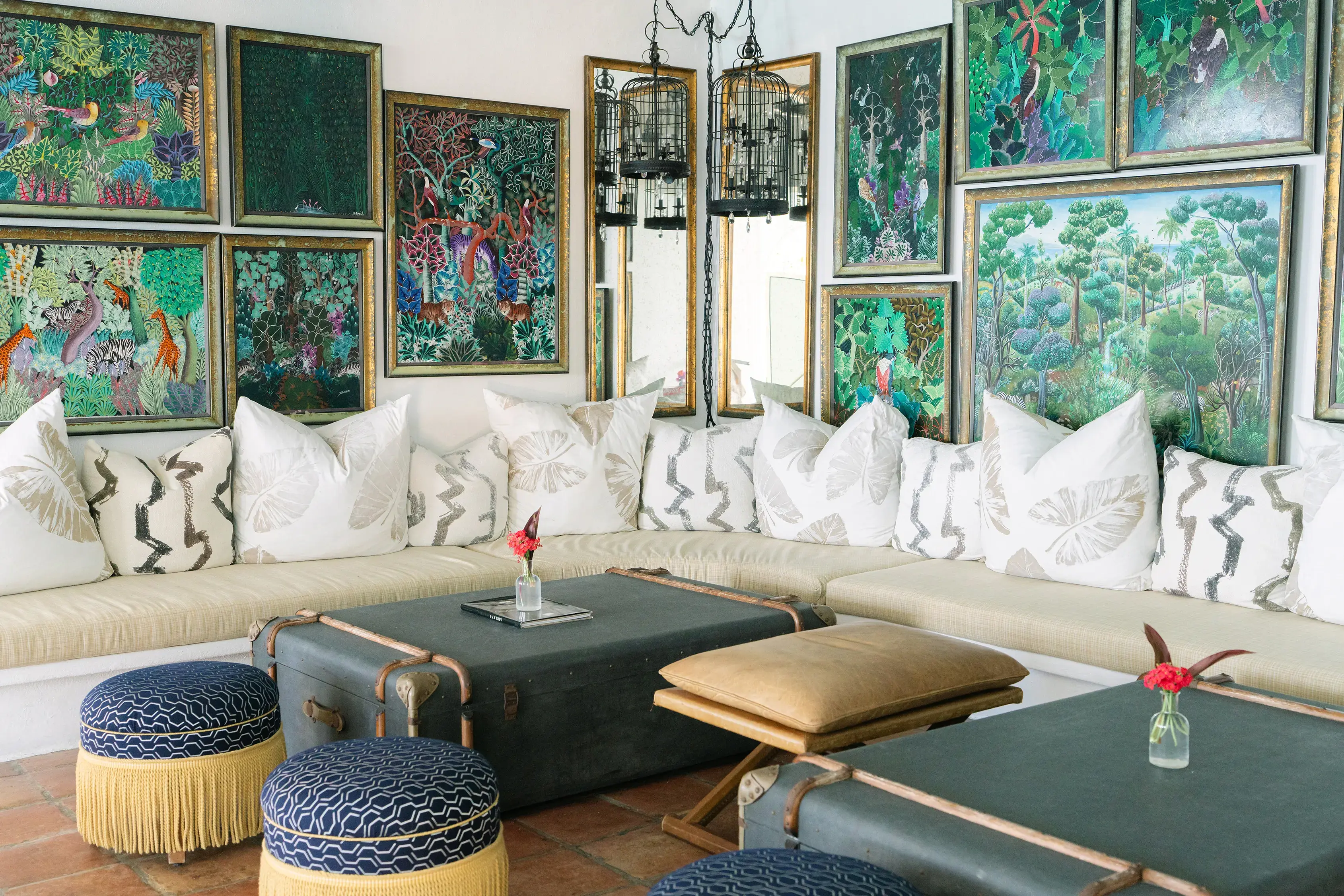 Stylish lounge of Bar Soleil at Malliouhana Resort, Anguilla, featuring vibrant tropical artwork, elegant Caribbean décor, and luxury boutique hotel ambiance.