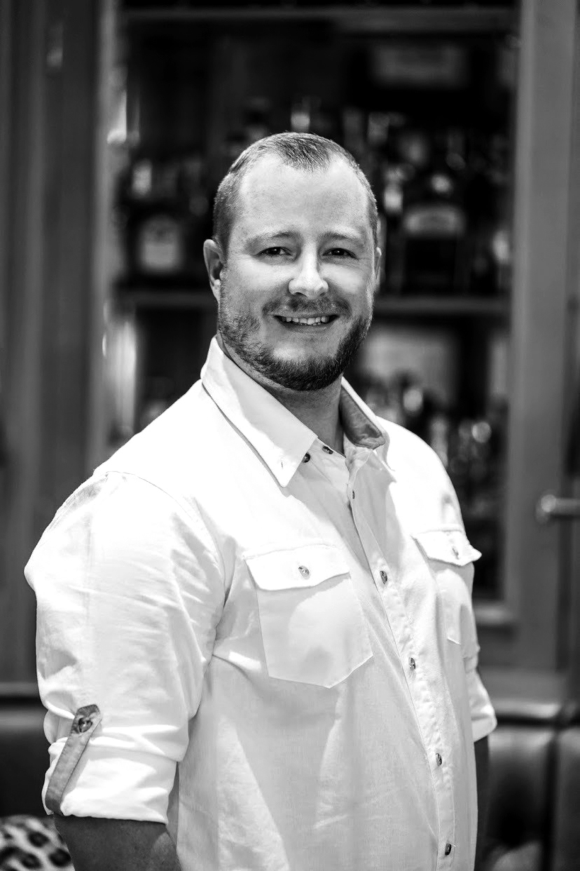 Portrait of Ben Seager the General Manager of Xigera Safari Lodge in black and white