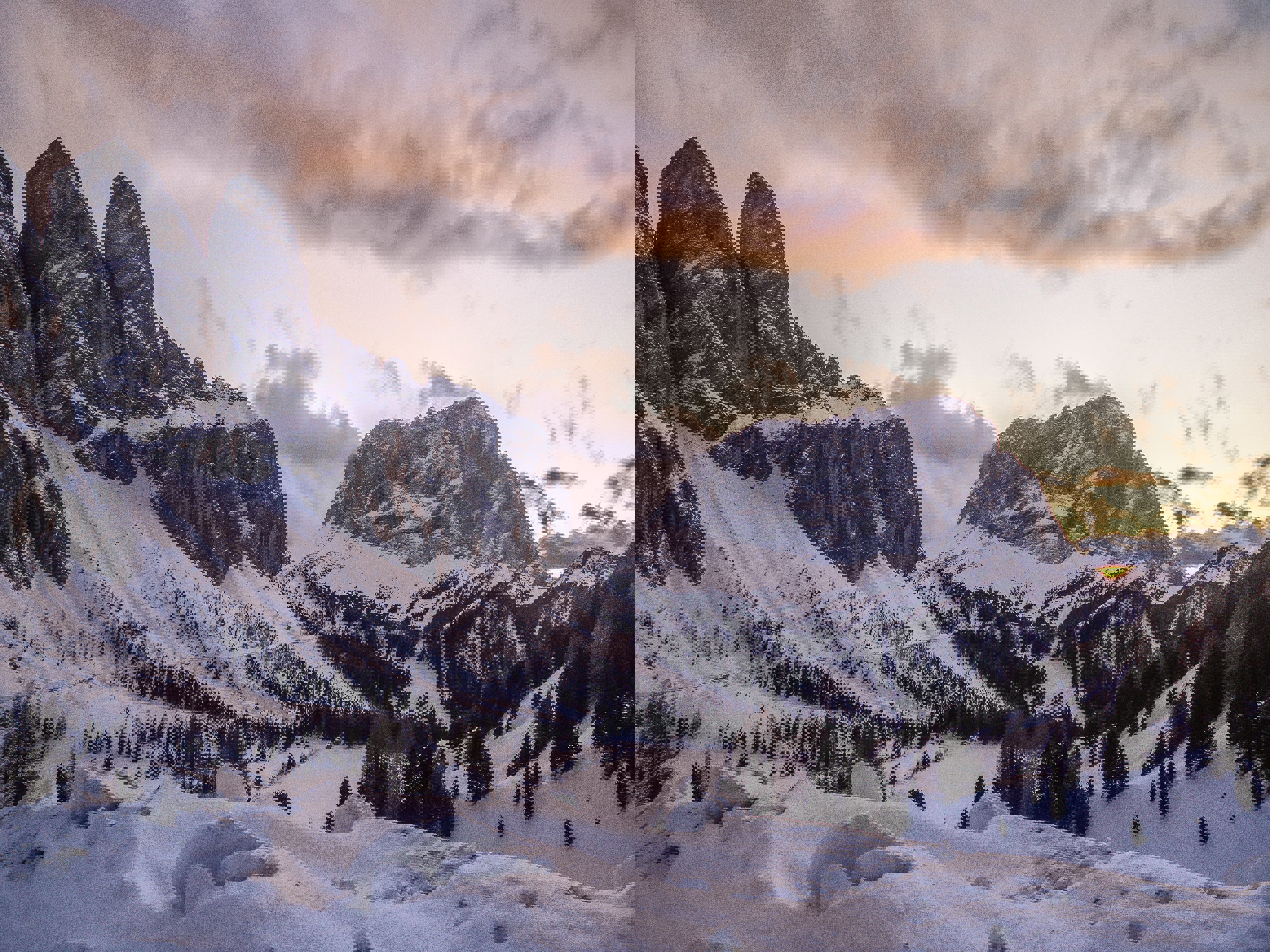 Sunset over snow covered mountain peaks of Val Gardena in the Dolomites