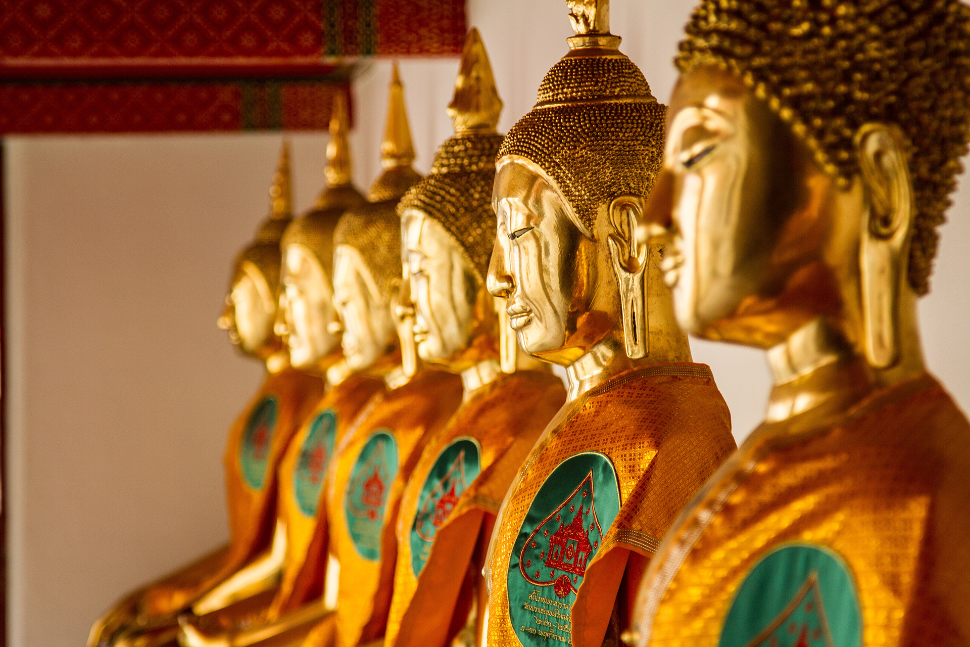 Gold and red hindu deity statues