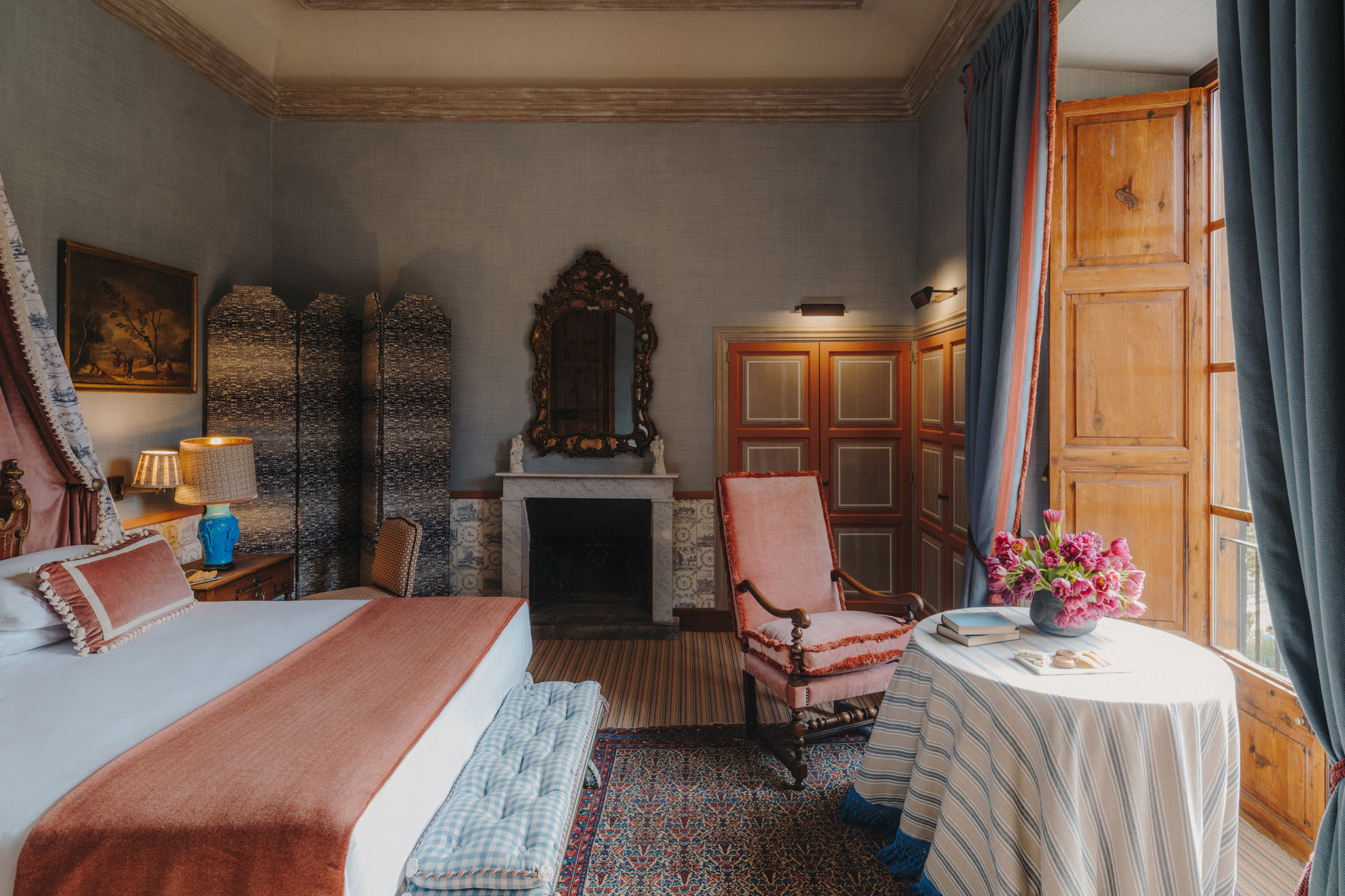 Palace Room with pink furnshings and fireplace