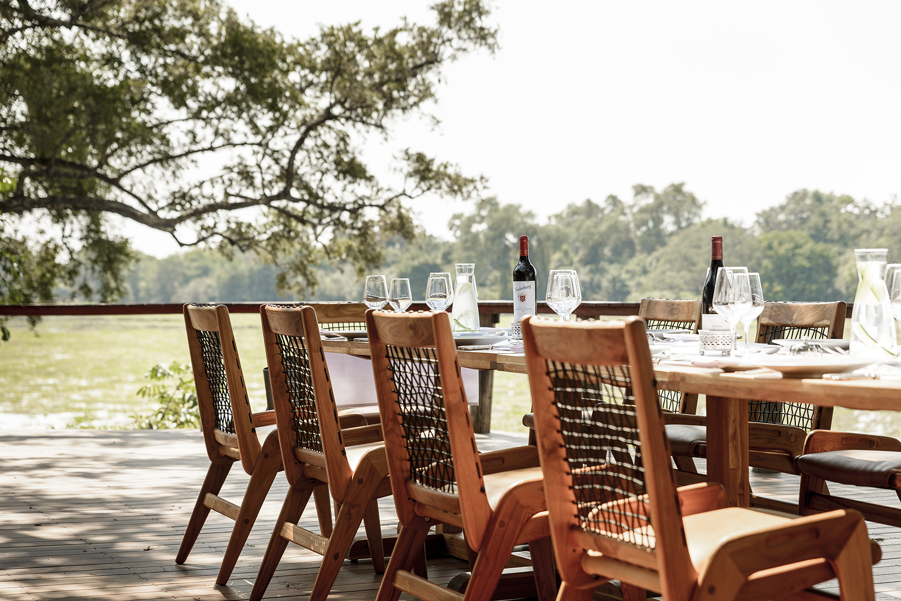 Africa, Zambia, Sungani Lodge, dining table set for dinner outdoors 