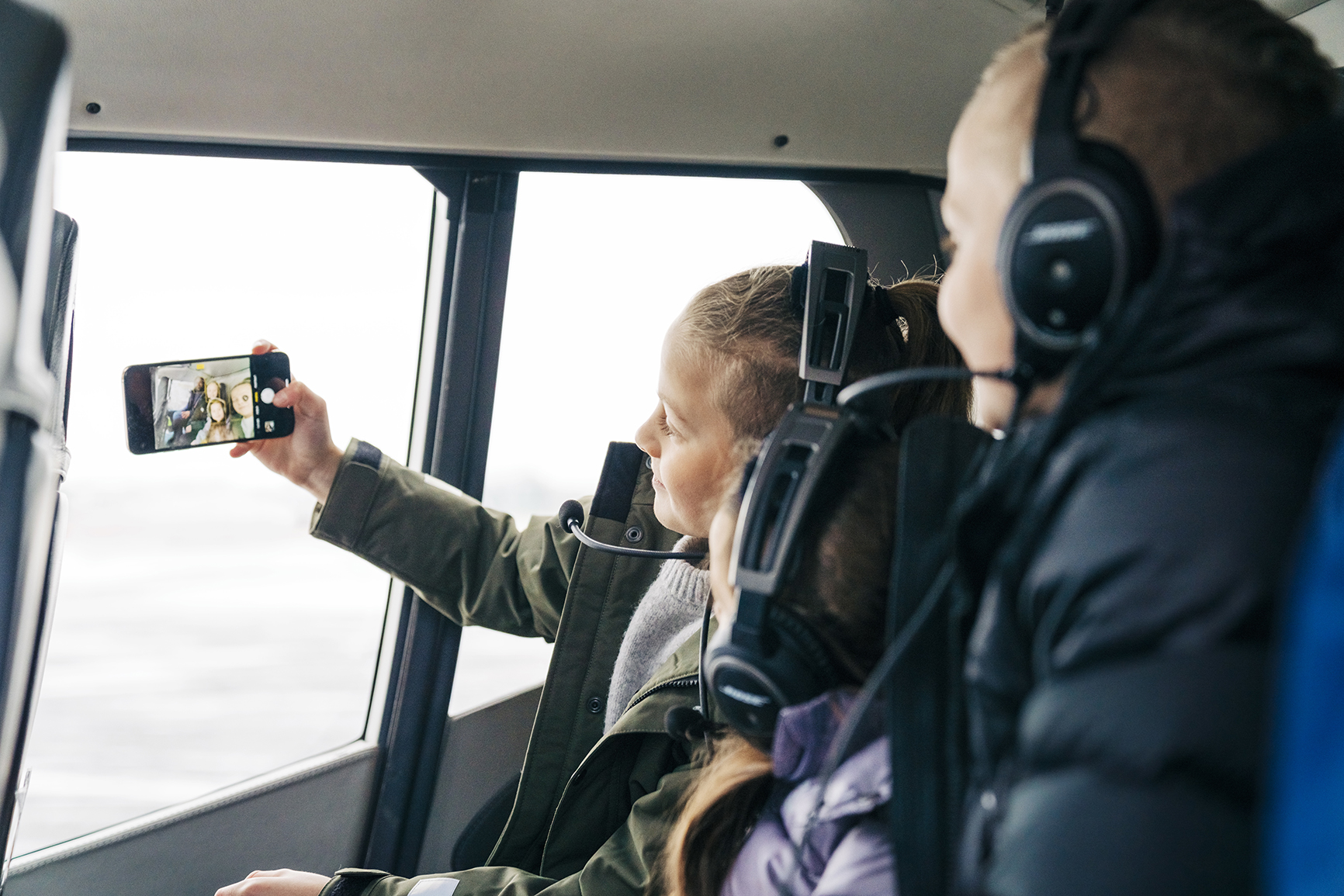 A family taking a selfie on a helicopter ride