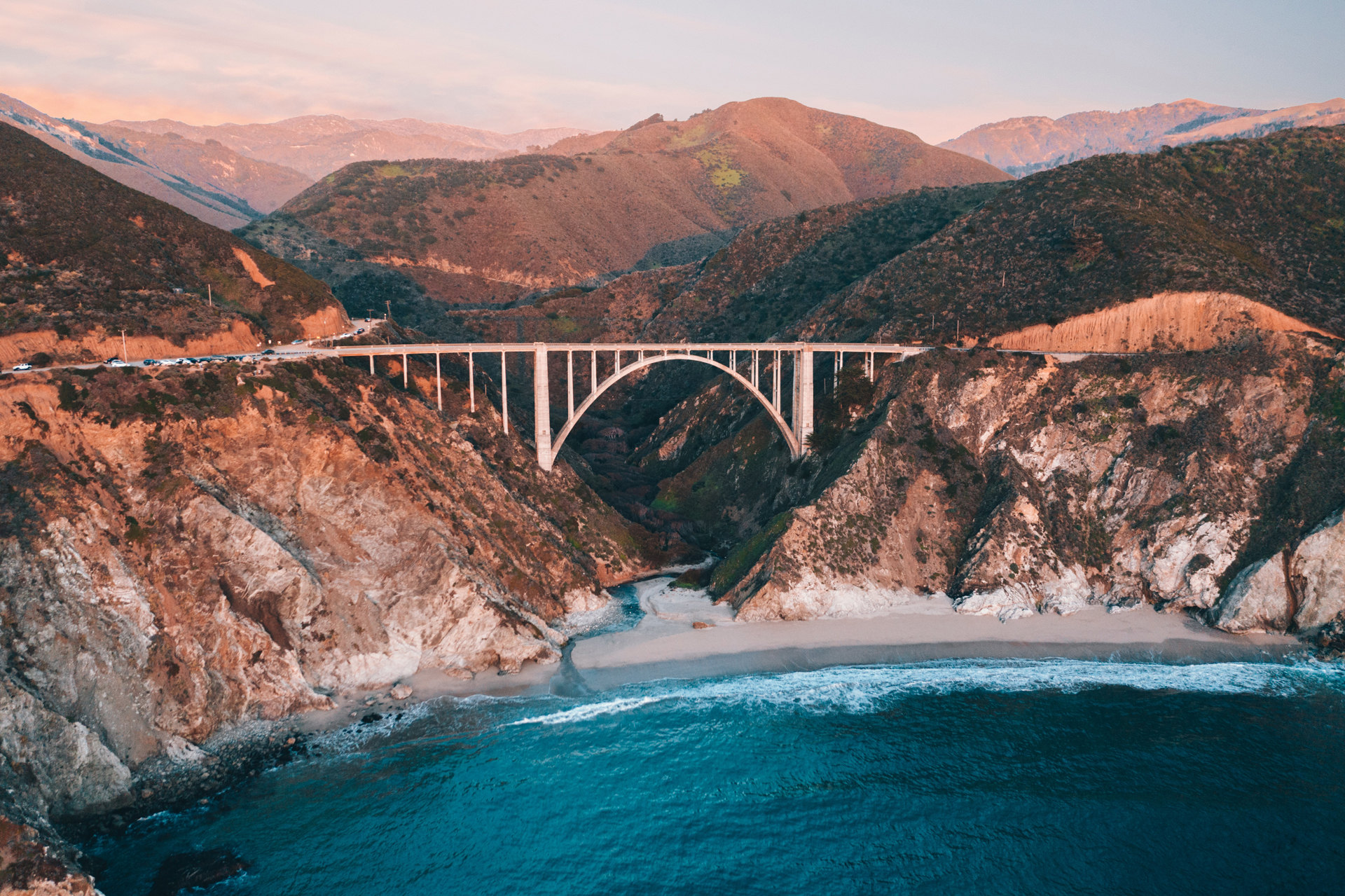 A big concrete road bridge crossing a coastal ravine