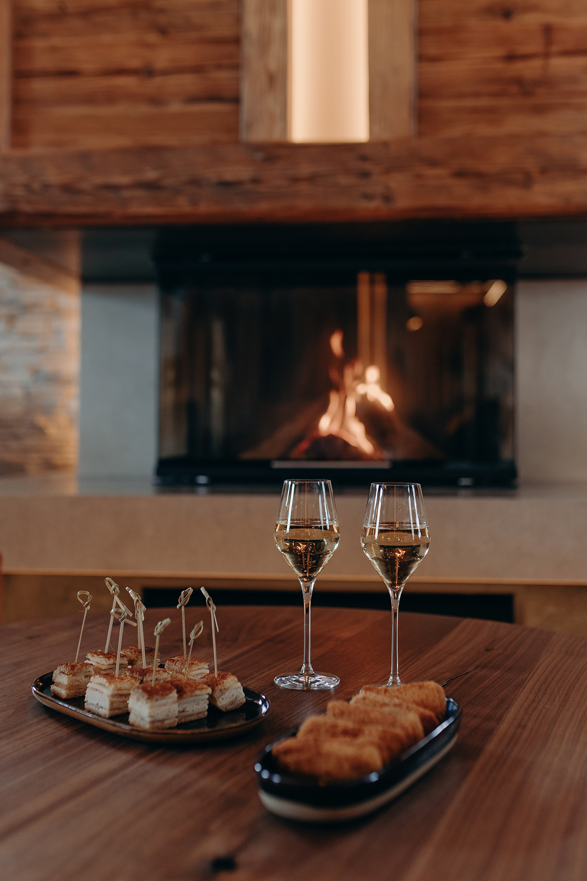 Ski & Snow, France, Megeve, Armancette, Salon Mont Joly canapes and drinks by the fireplace 