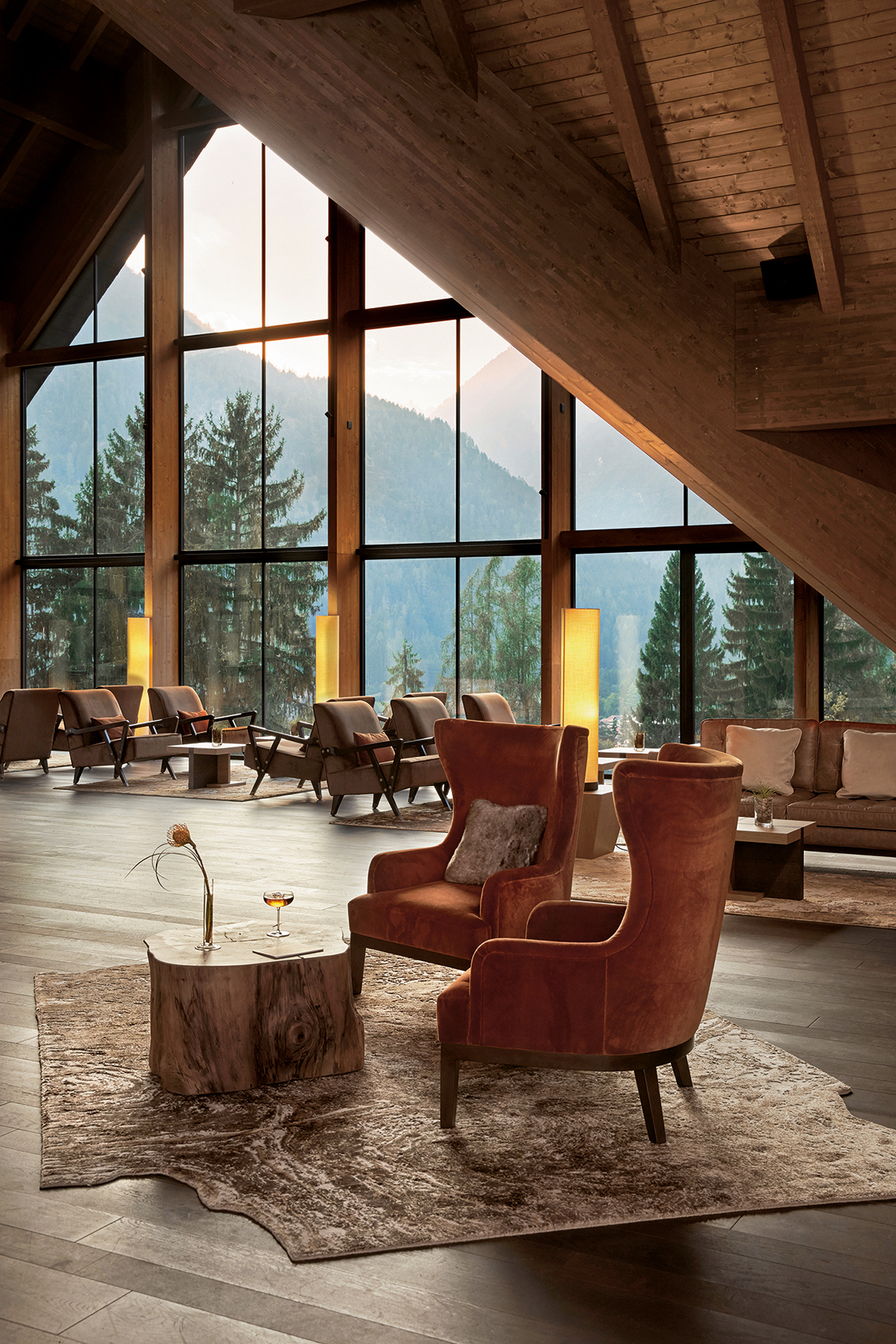 Plush chairs in the lobby of Lefay Dolomiti with views across the valley