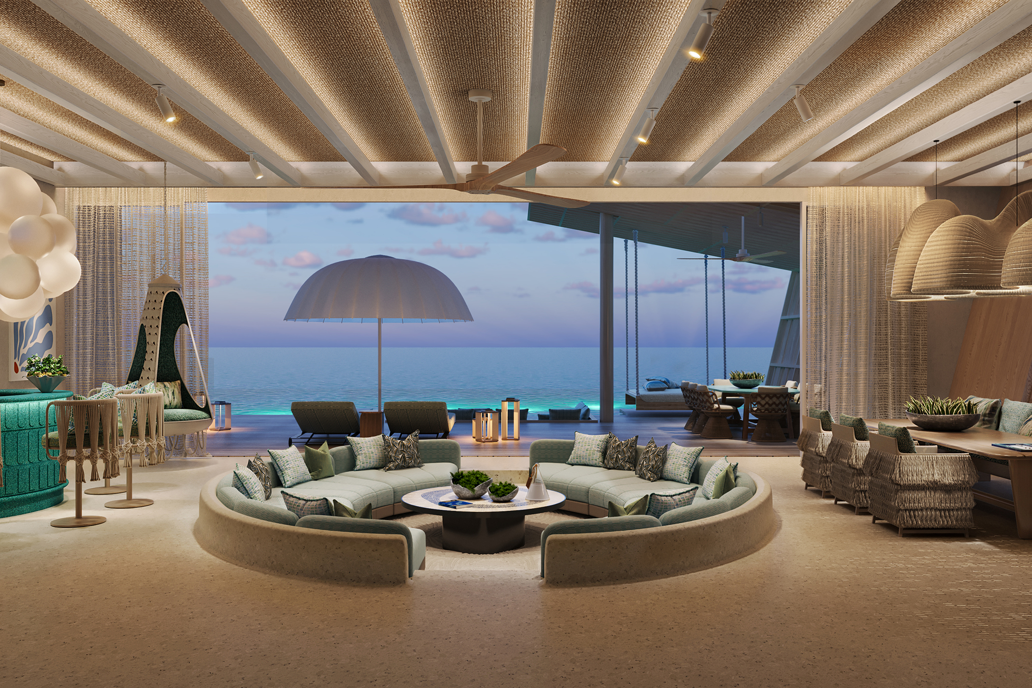 Beach Villa living room at .Here Resort in the Maldives with elegant seating, ocean views, and contemporary coastal design.