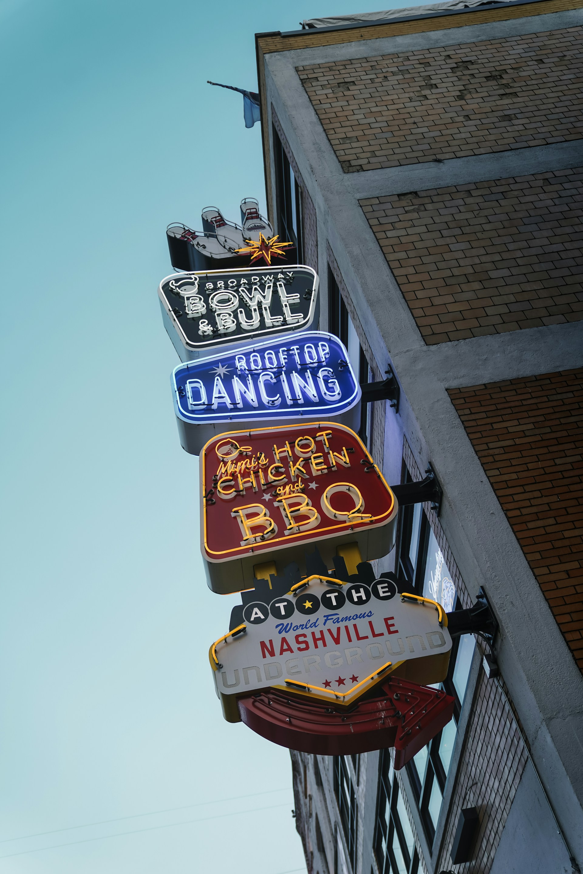 Colourful neon signs for Broadway Bowl & Bull, rooftop dancing and Nashville Underground in Nashville, Tennessee