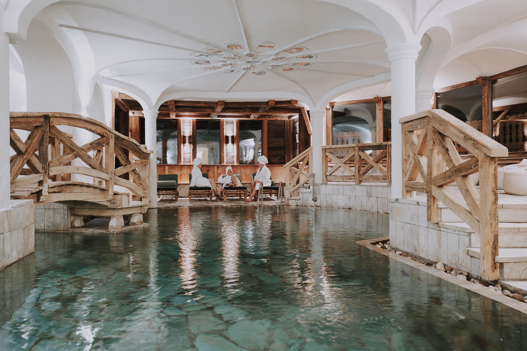 Italy ski holidays, The Dolomites, Hotel La Perla, women beside spa pool