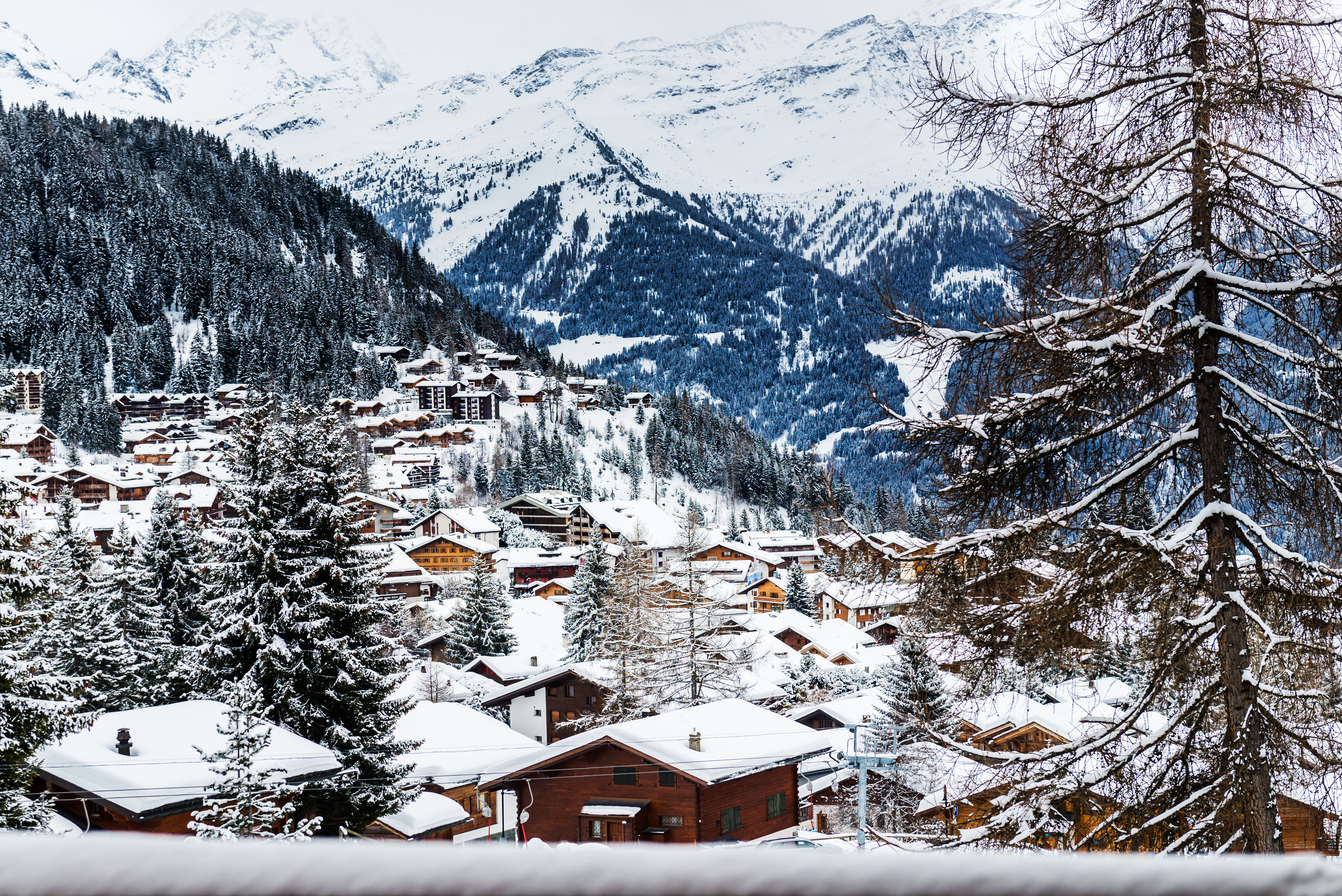 A view of buildings in a valley in the Swiss Alps