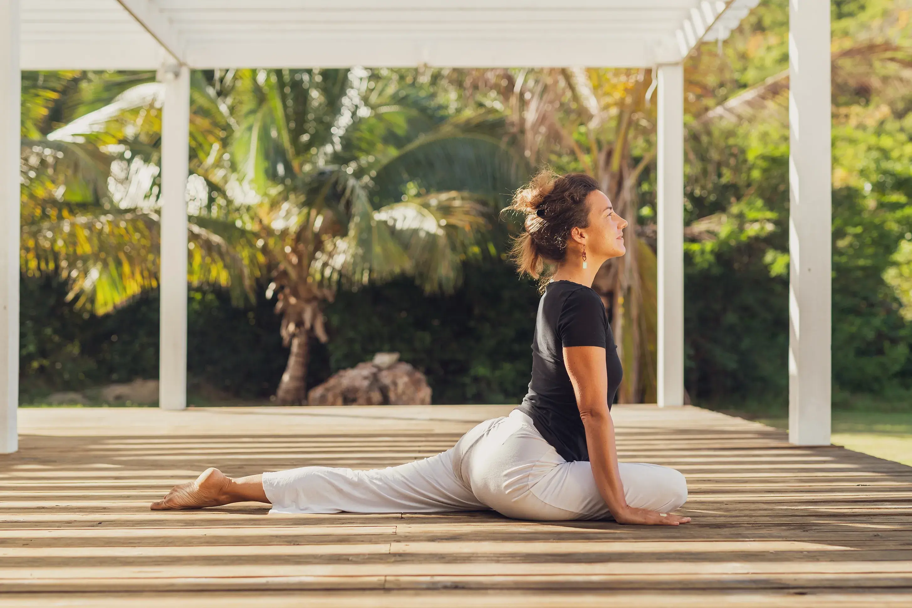 Woman doing yoga in the pavilion