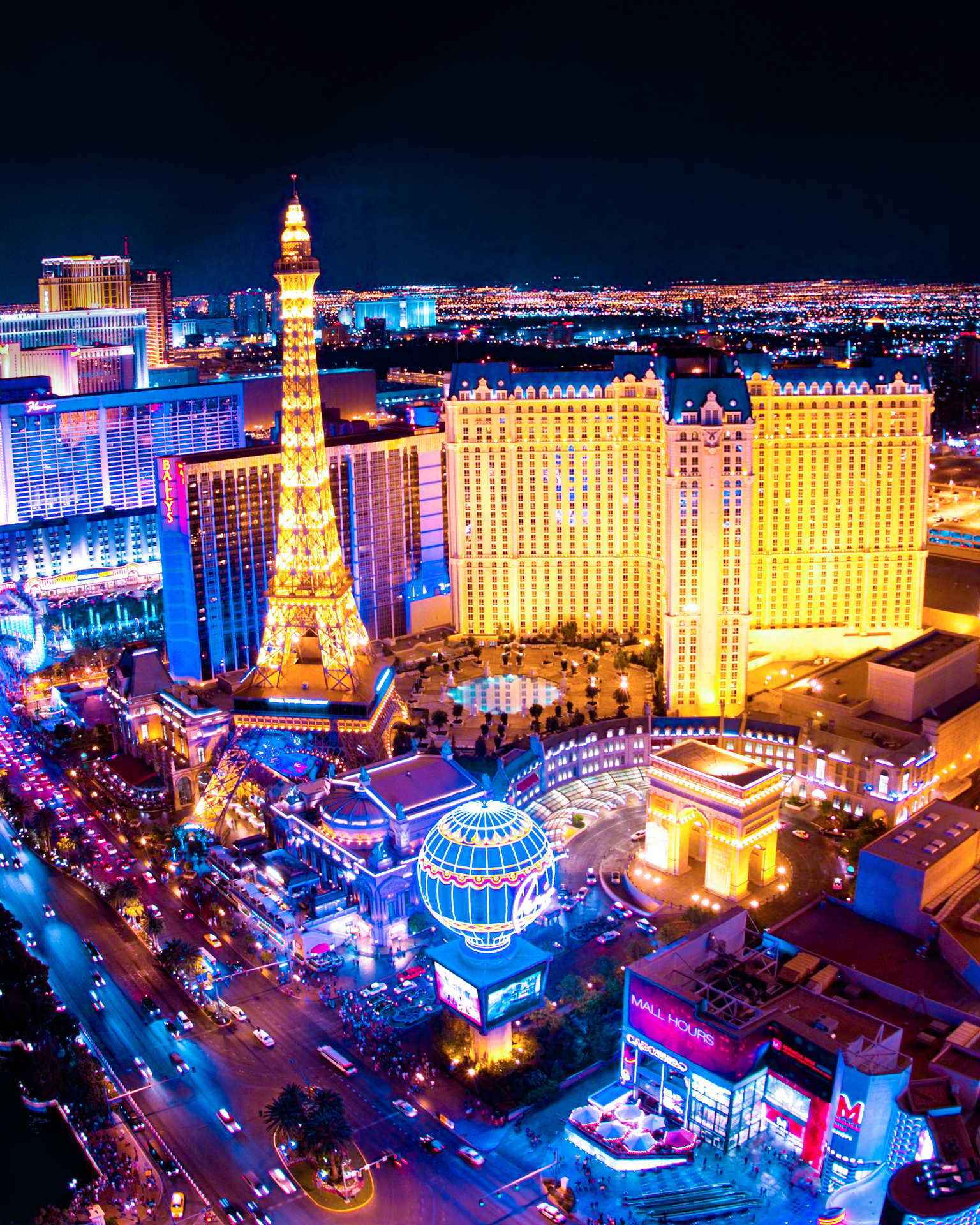 A bustling cityscape aglow with an abundance of lights