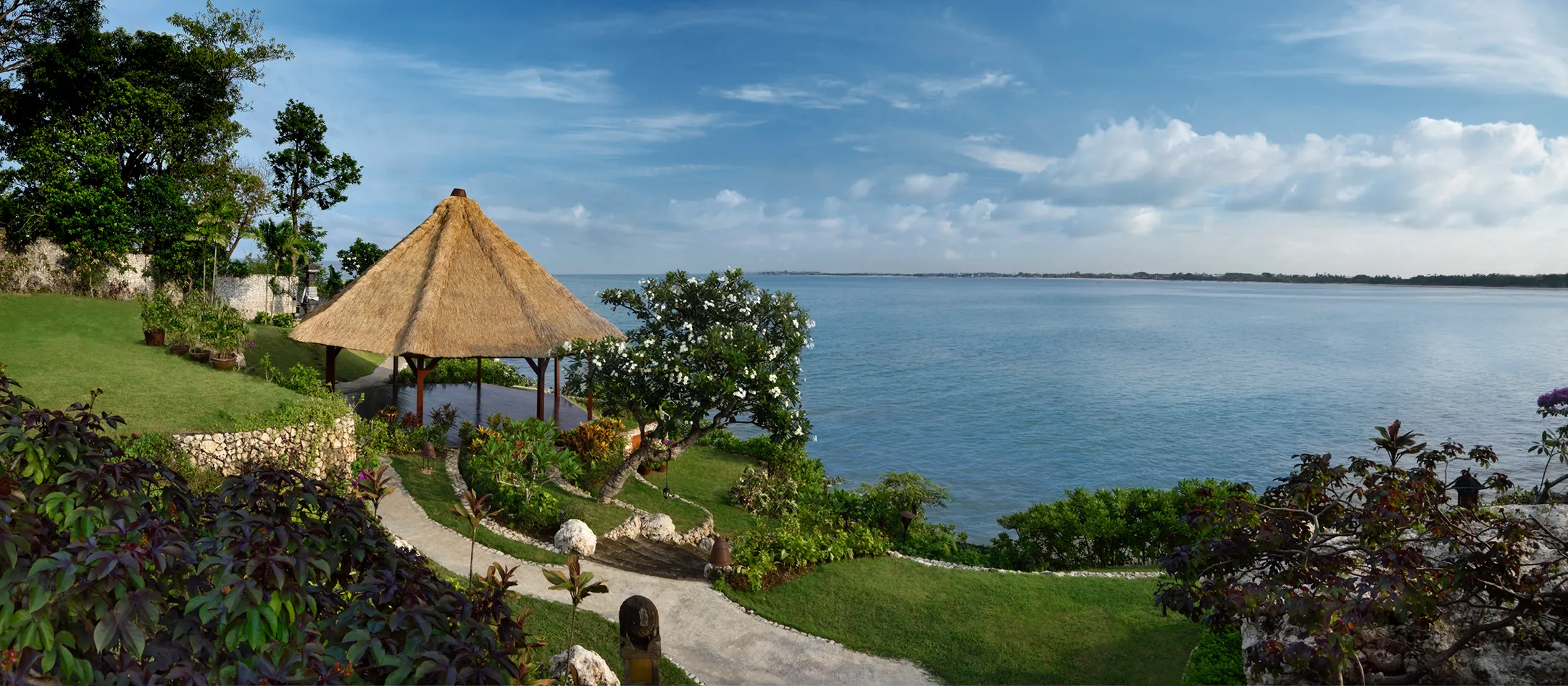 View of a pavilion and the bay at Four Seasons Resort Bali at Jimbaran Bay, Indonesia 