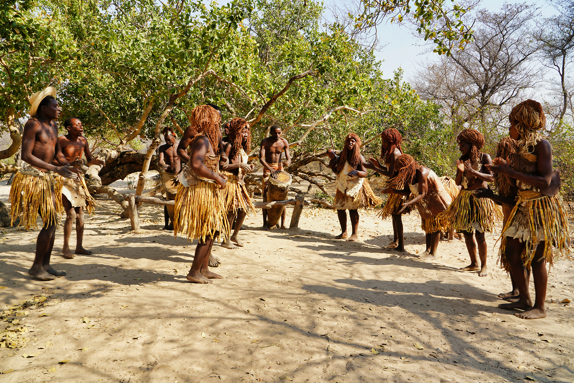 A tribe group playing music and dancing