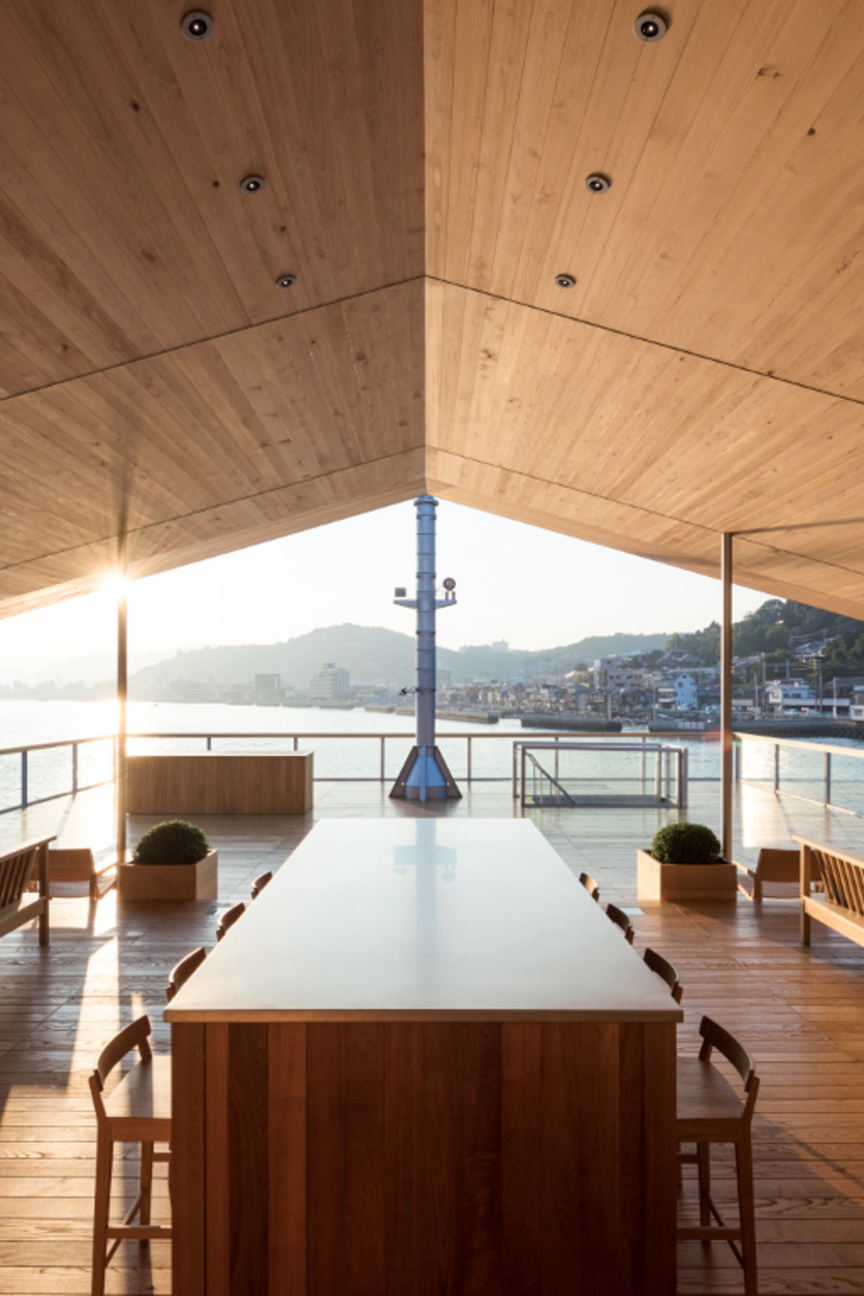 The lounge and seating area aboard Guntu beneath a wooden vaulted ceiling