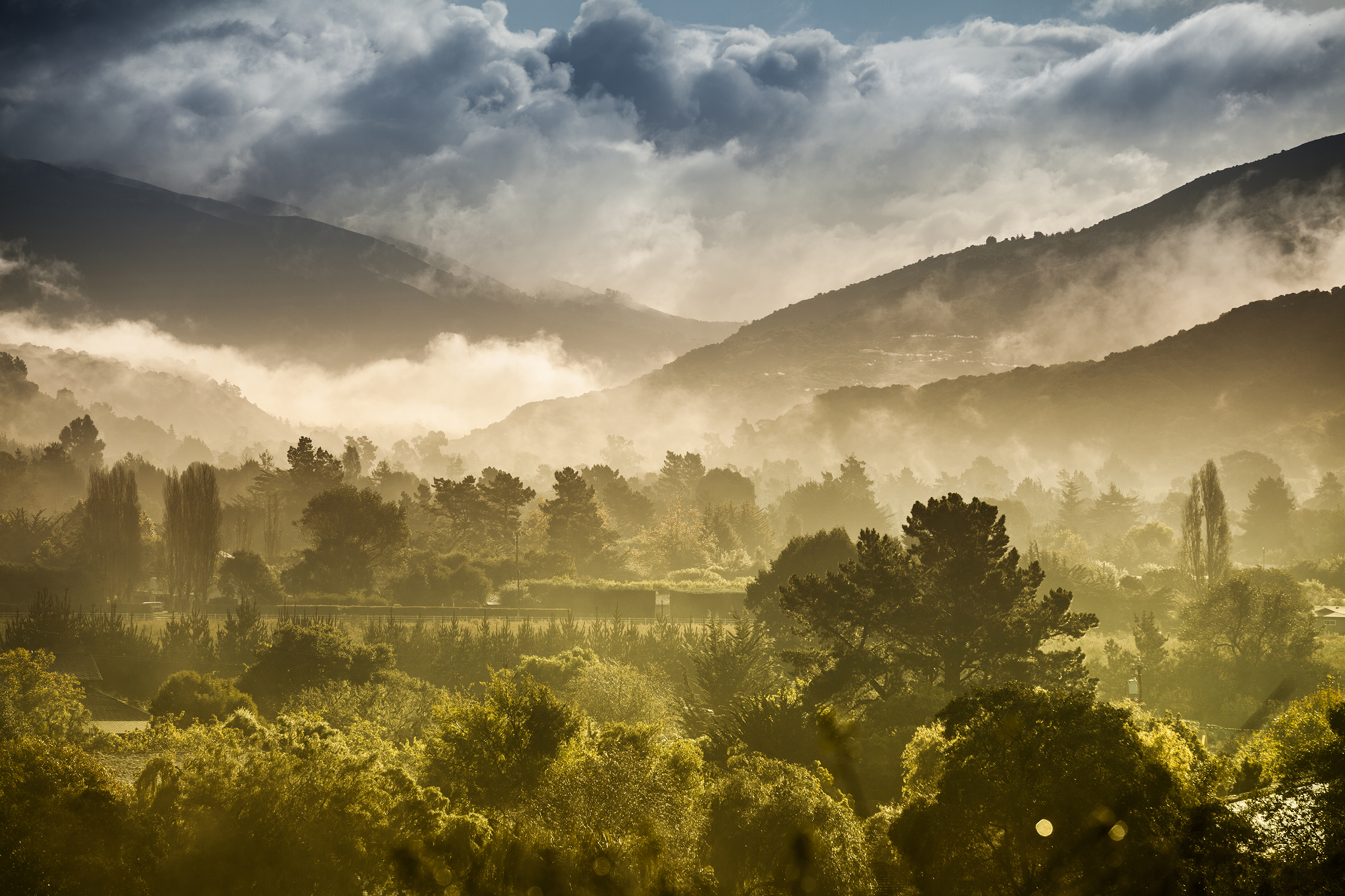 Sun rays through clouds over Carmel Valley