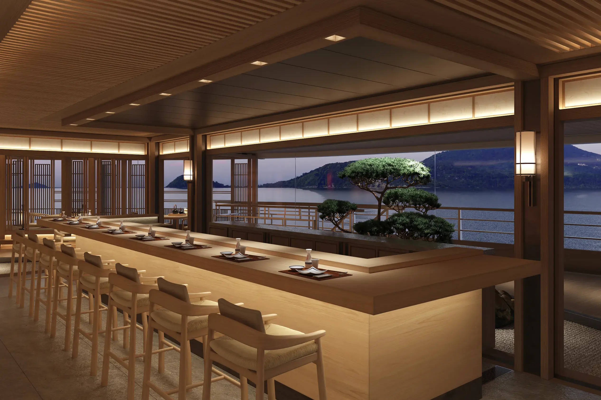 Akari restaurant aboard Amangati featuring a sushi bar in light wood and moody lighting, with a glimpse of a bonsai tree on deck outside before a landscape at twilight