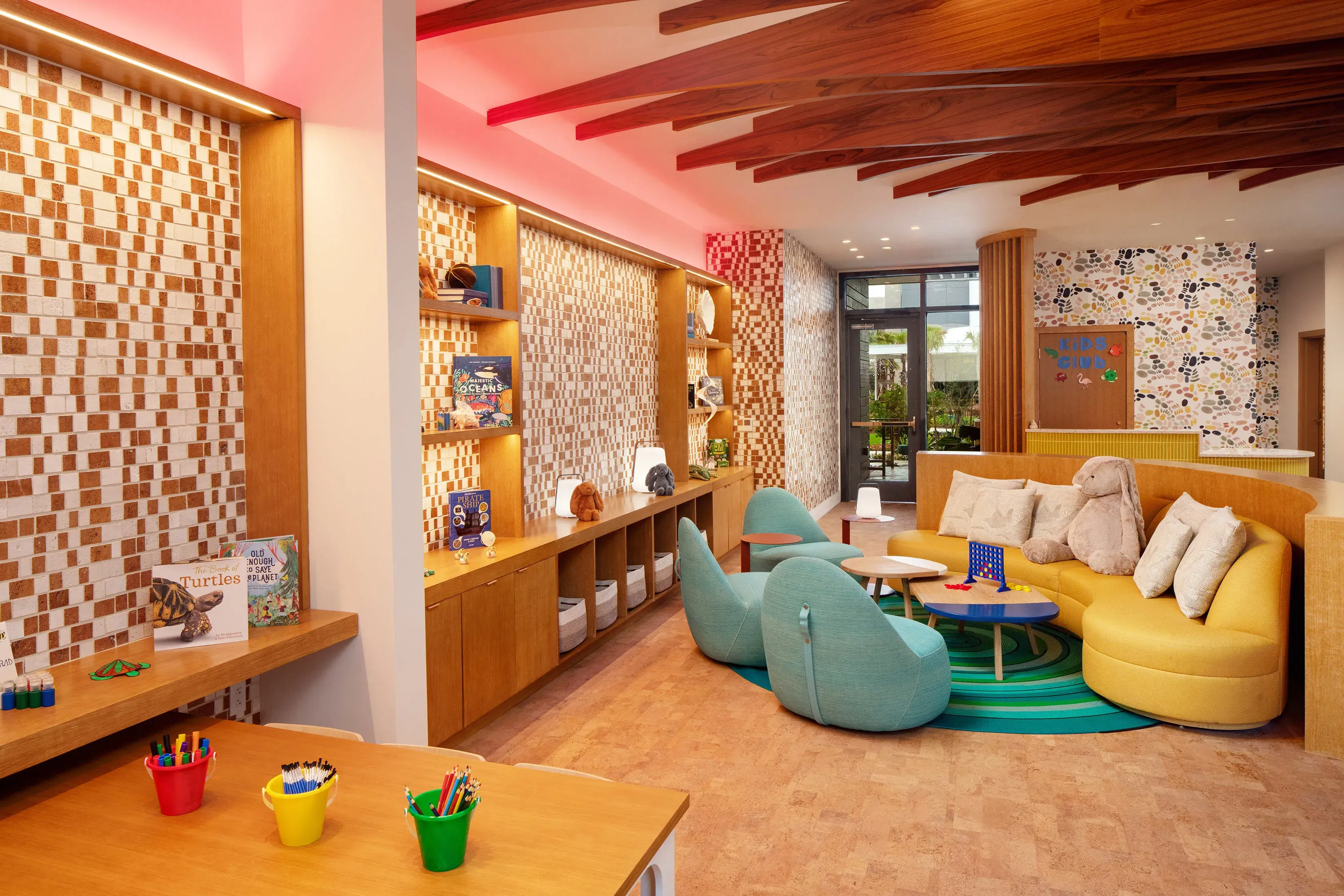 Colorful kids’ club at Conrad Orlando in Florida featuring cozy seating, creative play areas, and vibrant décor.
