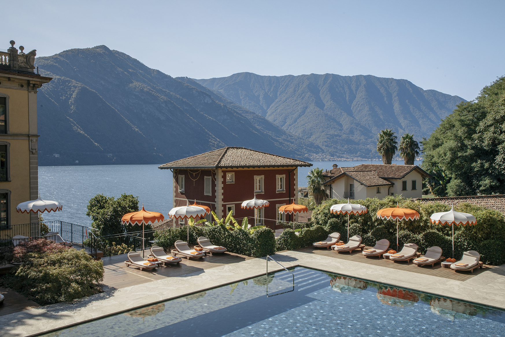 Europe, Italy, Italian Lakes, Lake Como, Grand Hotel Tremezzo, pool surrounded by sunloungers and parasols
